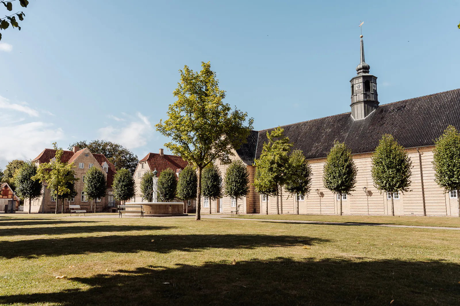 Brødremenigheds Plads with the Moravian church behind the lime trees in Christiansfeld